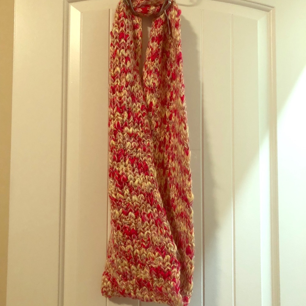Pink colored infinity scarf.
